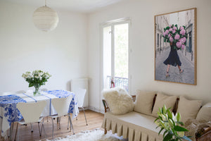 Free and Fearless is a photo of a girl in Paris in St Germain des Prés holding a giant bouquet of pink hydrangeas and is part of a limited edition series named Young Girl in Bloom by photographer Carla Coulson celebrating women loving and believing in themselves and building their self esteem by trusting their intuition.